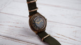 Vintage soviet mechanical men's watch VOSTOK, black dial, brass case